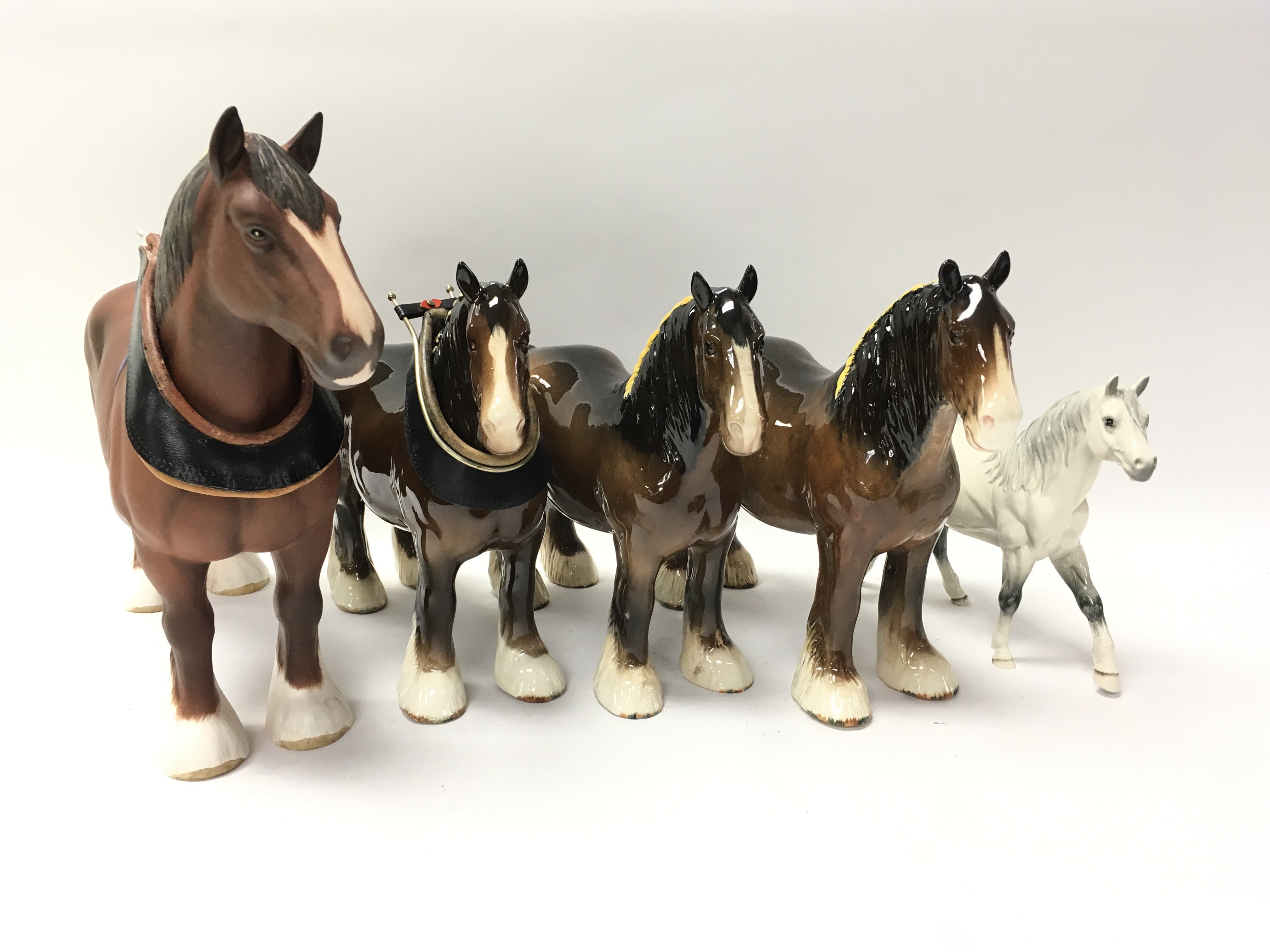 Five ornamental Beswick horses of various style.