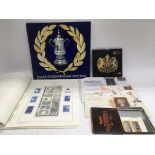 An album of Alderney and other Channel Island stamps plus a Royal Mint uncirculated coin collection,