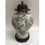 A 19th Century Chinese vase of baluster form and painted with a central pair of male and female