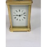 WITHDRAWN: A gilt case French carriage repeat clock the enamel dial with Roman numerals