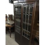 An oak bookcase with a pair of three Quarter lead light glazed doors - NO RESERVE