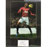 Two framed and glazed photos of footballer's with signatures comprising Antonio Valencia and