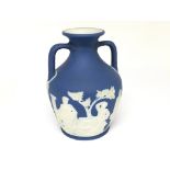 A Wedgwood Early 20th Century model of the Portland vase impressed marks to the base. No damage or