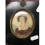 A Victorian portrait miniature of a lady in lacquer frame