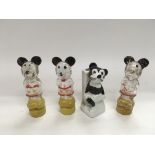 Three Mickey Mouse perfume bottles and a Mickey Mouse match holder (4).