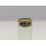 An 18ct gold cluster ring set with diamonds, emerald, sapphire and ruby, approx 6.7g and approx size