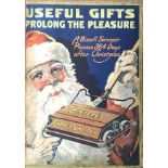 A Christmas themed advertising board for Bissell's carpet sweeper, measures approx 45.5cm x 65cm.