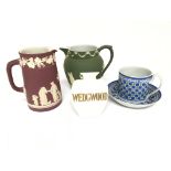 A collection of early 20th Century Wedgwood comprising two jugs a cup and saucer and a small