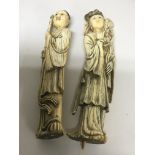 A pair of Early 20th Century Carved ivory sin oriental figures. Height 21cm