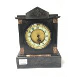 A Black Slate and marble Victorian clock.