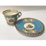 A Chamberlain & Co Worcester hand painted and gilded cup and saucer with birds. Minor gilt rubbing