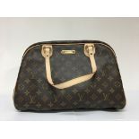 A Louis Vuitton handbag with LV padlock, handbag cover and original box. Very good condition, slight