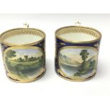 Two Matching 19th Century Derby Porcelain cups each painted with landscape and river views. Height