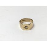 An 18ct gold gents ring set with a small diamond. Si