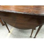 A mahogany drop leaf table the twin flap top above turned legs on pad feet - NO RESERVE