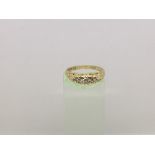 A ladies 18ct gold five stone diamond ring, approx .33ct, approx 3.8g and approx size N.