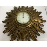 A French sunburst 8 day wall clock the dial with Arabic numerical with stamped French brass movemen