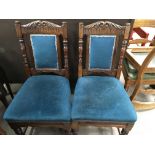 A set of six walnut chairs the upholstered back and seat on turned legs