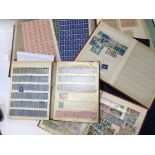 A collection of British and world stamps in albums including unused pre-decimal sheets. and other