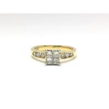 An 18ct yellow gold ring set with four central diamonds in a square formation, flanked either side