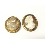 Two cameo brooches carved in the form of side port