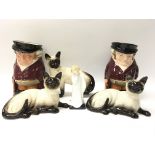 Three Royal Doulton ornamental cats, two Royal Doulton character jugs of The Huntsman and a small