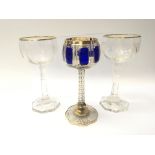 Three Quality wine goblets one with blue overlay and applied gilt the other pair with quality