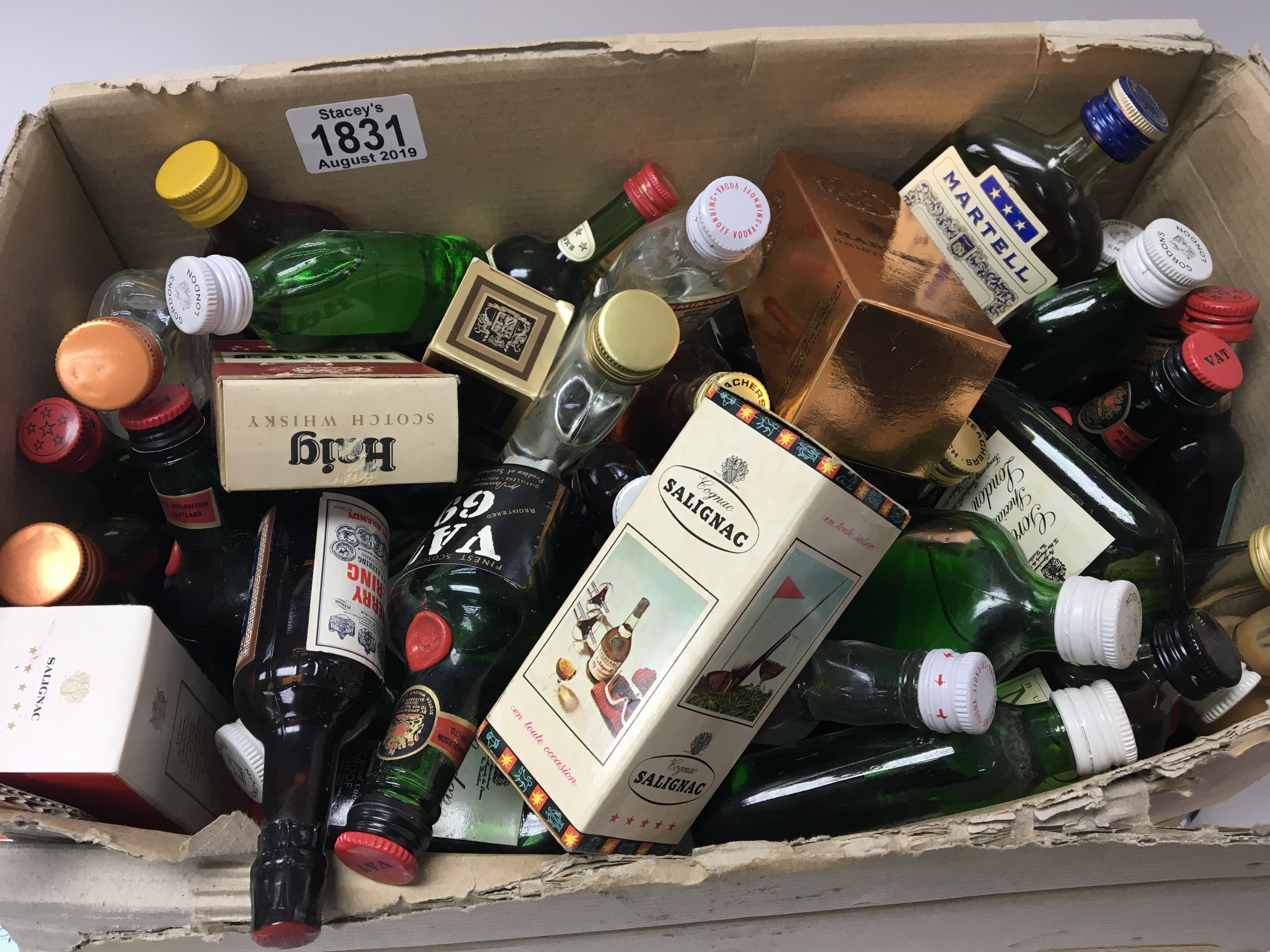 A box containing a quantity of miniature bottles of spirits including some in boxes including whisky