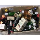A box containing a quantity of miniature bottles of spirits including some in boxes including whisky