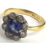 A 22ct gold ring set with simulated sapphire in diamond surround. Ring size approx S, total weight