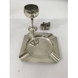 A silver ash tray together with silver stem cup and lighter