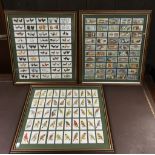 Three framed sets of cigarette cards comprising tw