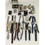 A collection of wristwatches, lighters and odds