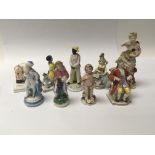 A collection of 19th Century English and Continental miniature figures. Height 11cm.