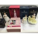 Four boxed Royal Doulton figures of ladies plus a smaller boxed Doulton figure of a lady (5).