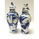 Two Chinese Export 19th Century Porcelain vases decorated with figures caricature marks to the base.