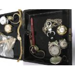A box containing a collection of dress watches together with a small 9 ct gold cased ladies watch