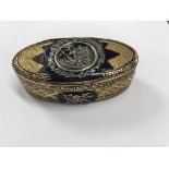 A 19th century oval gilt metal and enamel box silver mounted with classic decoration