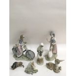 Four Lladro models of a girl on a bike, a rabbit donkey and a bull plus similar figures. Minor