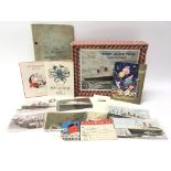 A collection of shipping related items to include postcards, programmes and a boxed puzzle.