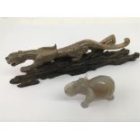 A polished hard stone model of a cheetah and an agate elephant.Approx 24cm and 7cm