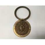 A Lacquered brass door knocker with restoration, possibly 19th century.