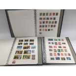 Three albums of mixed World stamps.