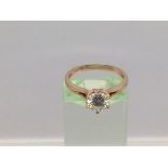 An 18ct rose gold moissanite ring, approx 1ct, approx 2.65g and approx size N-O.