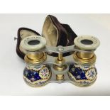A Quality pair of French decorated enamel and gilded metal opera glasses.