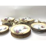 A Japanese Porcelain dinner service six place setting. decorated with hanging flowers and foliage.