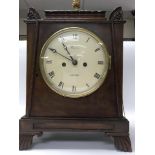 A regency mahogany case metal clock the enamel dial with Roman numerals with fusee movement striking