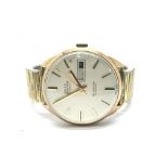 A gents 9ct gold cased Emperor self winding 25 jewel wristwatch with date aperture. Seen in