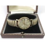 A Garrard & Co watch with possible 9ct gold case. Comes in original case with a Garrard booklet.