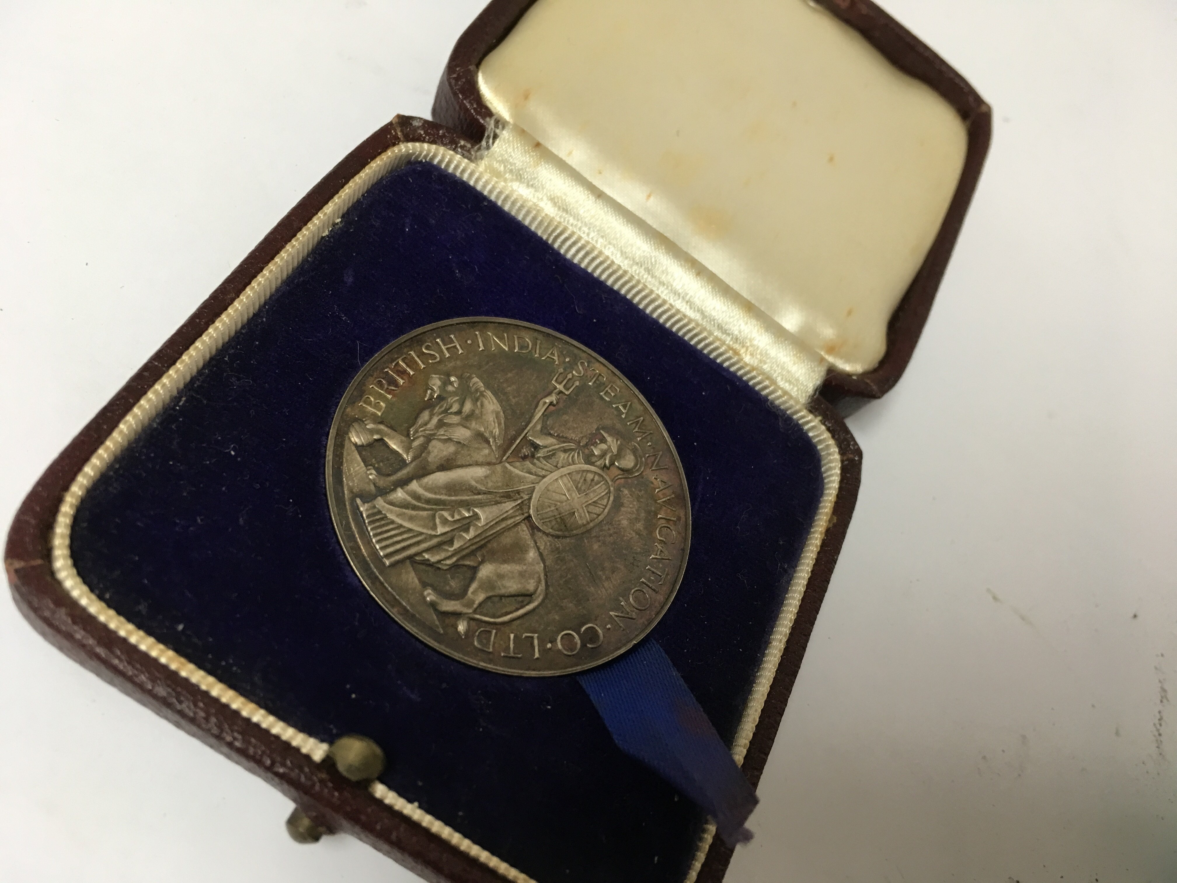 A Silver British Indian steam navigation medallion in original case and a small collection of